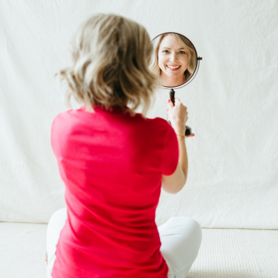 Amanda McKinney looking in a mirror